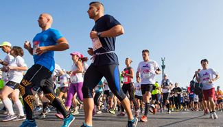 People attend half marathon in Budapest, Hungary